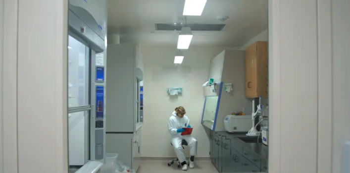 Image of woman sitting in lab