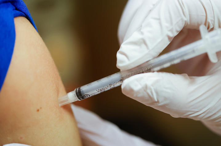 close up of administering vaccine