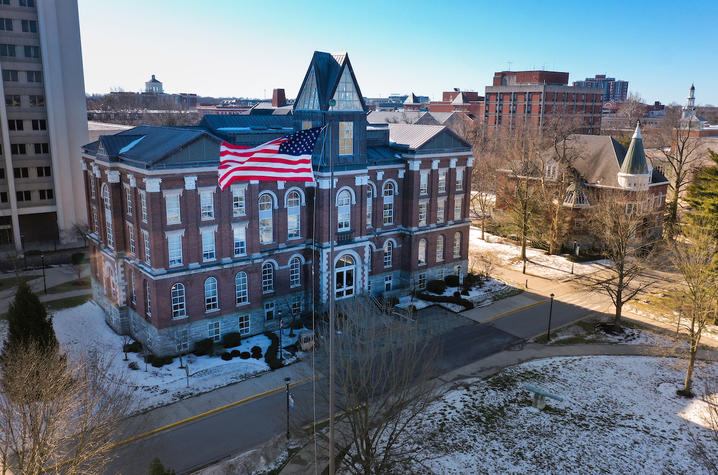 aerial view of building with American flag in front
