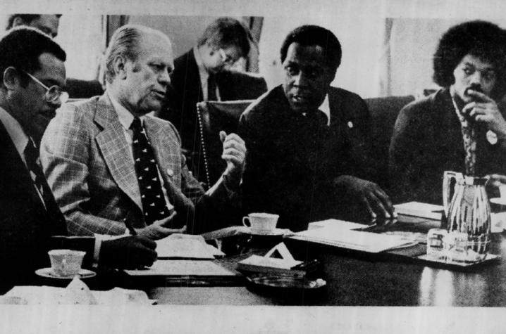 Black and white photo of US President Gerald Ford officially recognizing Black History Month during meeting