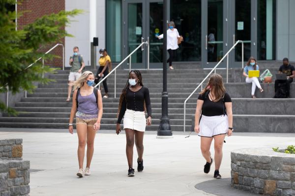 Photo of students walking across campus