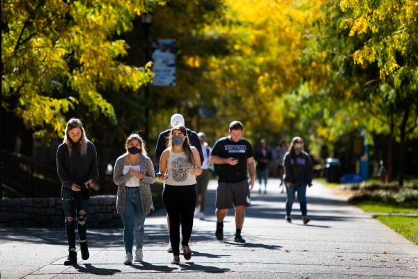 Group of students walking on a fall day 