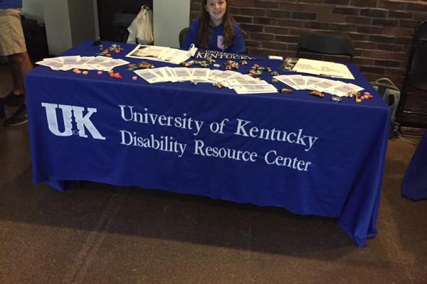 table with blue tablecloth covering reading University of Kentucky Disability Resource Center