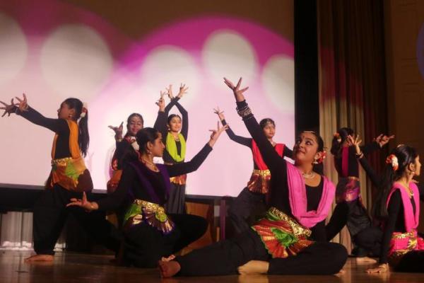 Indian dancers performing Diwali performance on stage