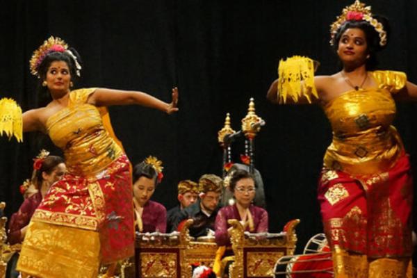 women in traditional outfits performing on stage