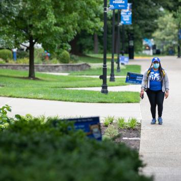 Photo of student walking on campus